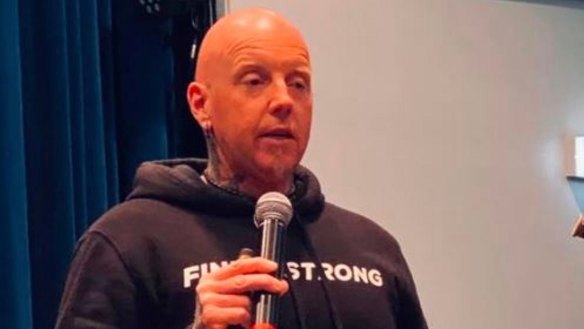 Motivational speaker John McMahon allegedly breached restrictions. 