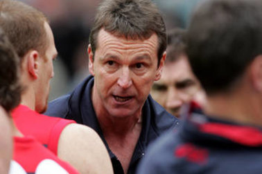 Daniher trying to lift the Melbourne players against St Kilda in 2005.
