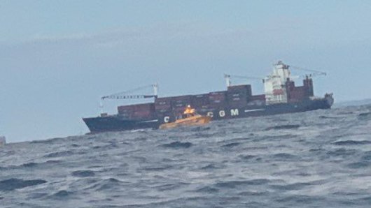 Cargo ships off the Sunshine Coast were asked to keep an eye out for the trio from the sunken boat.