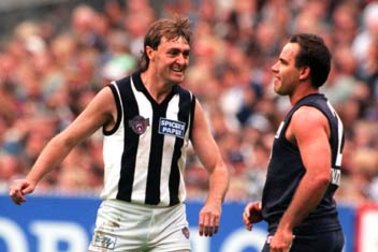 Mick McGuane, left, during his playing days at Collingwood. 