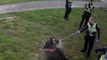 CCTV footage showed a disability pensioner being hosed by police.
