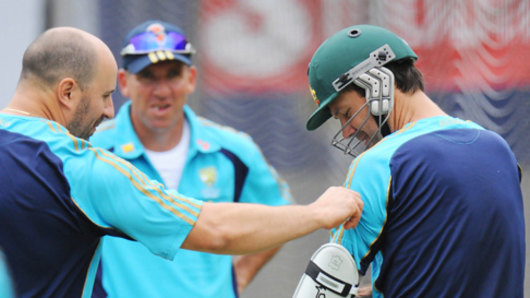 Alex Kountouris, left, in his days as Australian team physio.