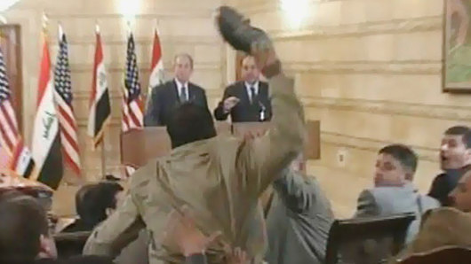 Muntazer al-Zaidi is caught on film throwing a shoe at George W. Bush.