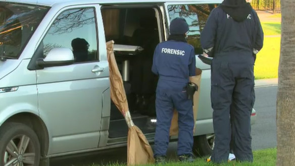 A shovel is taken away for further examination.