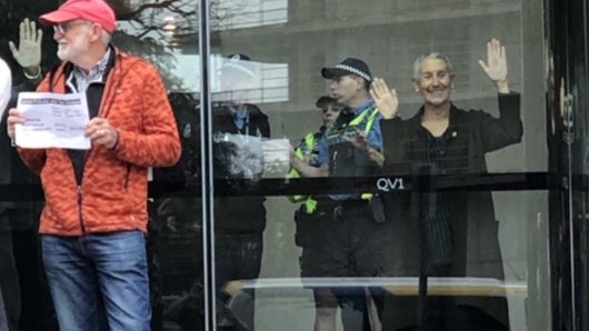 Grandparents from Extinction Rebellion's WA chapter have superglued themselves to Chevron's headquarters in Perth.