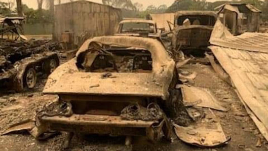 Mr Belmore's cars at his property sit burnt out after the bushfire. 