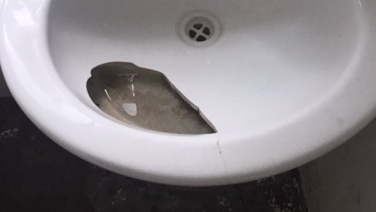 Broken sink in the bathroom. 