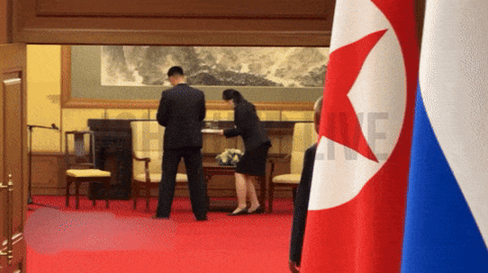 North Korean staff wipe surfaces.