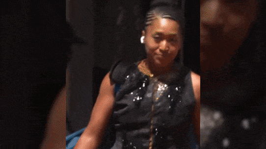 Naomi Osaka makes a bold entrance to her first-round match in Paris.