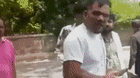 Sole plane survivor Viswash Kumar Ramesh walks on the street after fleeing the wreckage.