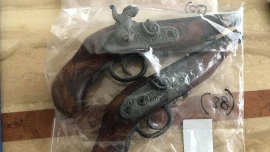 Five firearms and ammunition were discovered in the raids, police allege.