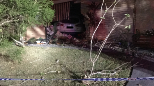 Police appealed for information after a car crashed into a home in the Gold Coast suburb of Ashmore early on Sunday morning.