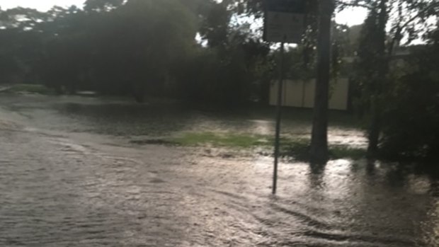Flash flooding at Yeronga’s Orient Street Park on May 12, 2021, threatens homes. Residents say illegal fill behind a nearby industrial property prevents floodwaters from getting away quickly. 