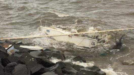 Empty boat washes up on rocks, prompting plea to help solve the mystery
