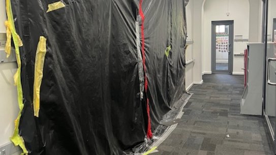 Plastic covering black mould in a classroom at Fitzroy North Primary School.