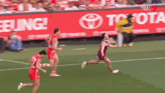 Players, Chris Fagan and fans celebrate the victory.