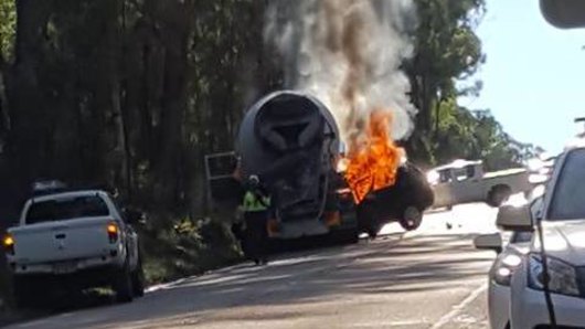Flames engulf a car and cement truck that collided on Heathcote Road on Wednesday afternoon. 
