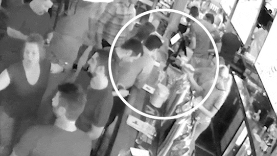 CCTV of Bruce Lehrmann handing over a card to pay for drinks. The Federal Court heard Lehrmann did not produce bank records for the transaction.