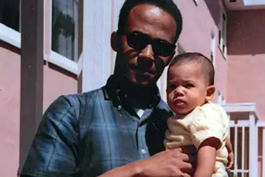 Donald J. Harris holding his daughter, Kamala, in April 1965.