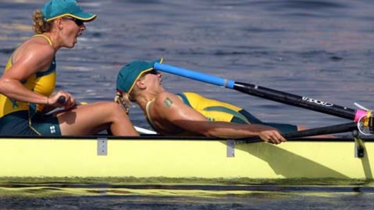 Sally Robbins lays back on boatmate Julia Wilson in Athens in 2004.