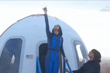 Katy Perry kisses the ground after all-female celebrity Blue Origin space flight.