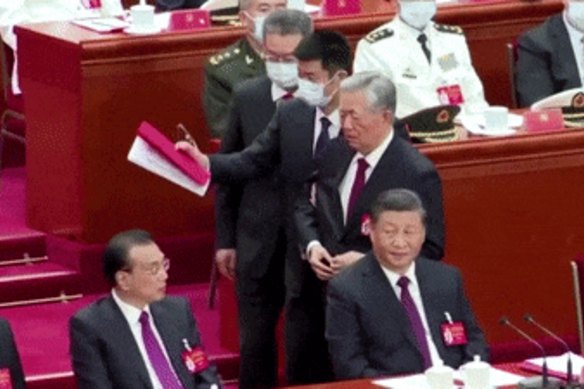 Former Chinese top leader Hu Jintao was unexpectedly led out of the closing ceremony of a major meeting of China’s ruling Communist Party on Saturday.
