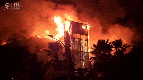 A building burns during rioting in Indonesia.