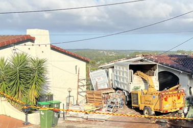 The truck’s cabin was left hanging over a small cliff with a 10-metre fall.