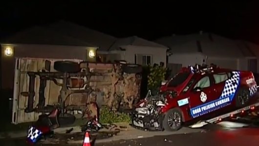 The smashed-up ute and police car in the Ipswich suburb of Collingwood Park.