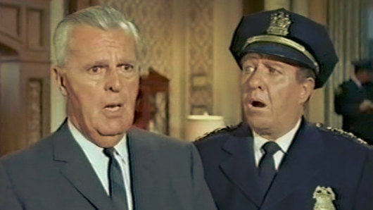 Commissioner Gordon (left) declares a state of emergency. Police Chief O’Hara is horrified cops will be enforcing COVID rules.