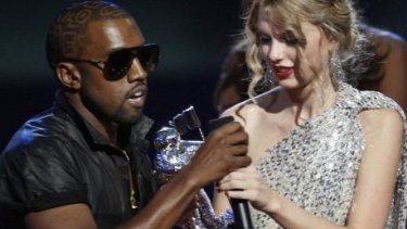 Oh no, he didn't: Kanye West takes the microphone from best female video winner Taylor Swift as he praises the video entry from Beyonce at the 2009 MTV Video Music Awards.