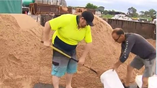 People in Cairns are sandbagging in preparation for Tropical Cyclone Owen