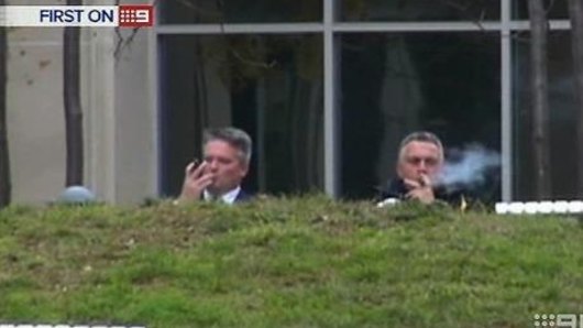 Then-finance minister Mathias Cormann (left) and then-treasurer Joe Hockey enjoy their cigars in 2014.