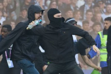 Police released this image from Saturday night’s derby pitch invasion.
