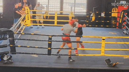 Boxer Justis Huni hits the canvas during sparring in January.