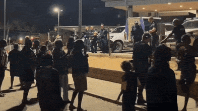 Chaos erupts as angry crowds converge on hospital after arrest of fugitive Jefferson Lewis