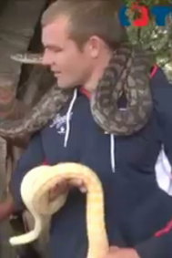 Martin Kennedy with a snake around his neck.