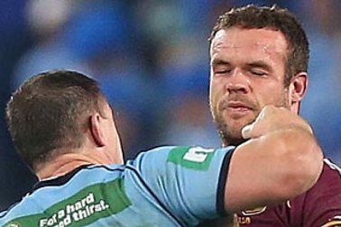 Nate Myles about to cop a punch from Paul Gallen.