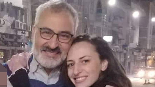 Hazem Hamouda with his daughter Saja when he was released from police custody.