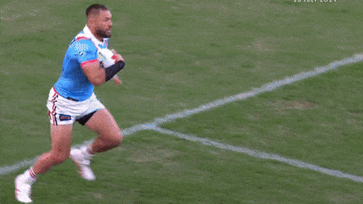 Moses Suli takes a brutal hit early in the Anzac Day clash.