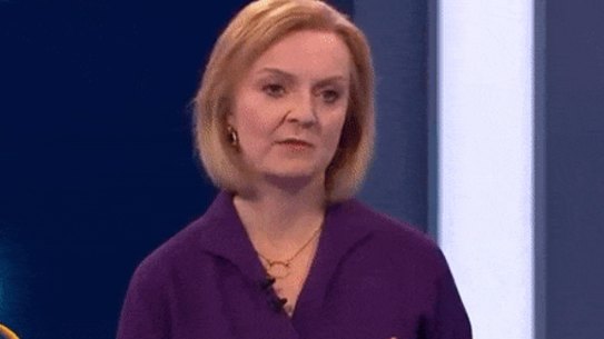 Liz Truss reacts to the presenter fainting.