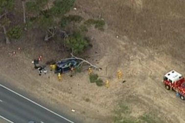 A woman has died and a baby is injured after a crash on a notorious stretch of road west of Melbourne.