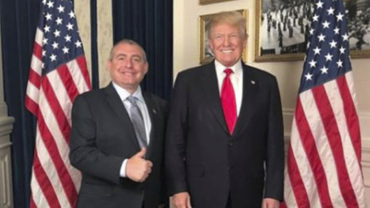 US President Donald Trump standing with Lev Parnas.