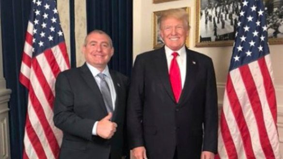 US President Donald Trump standing with Lev Parnas.