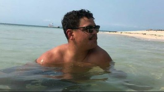 Latrell Mitchell relaxes on the Great Barrier Reef.