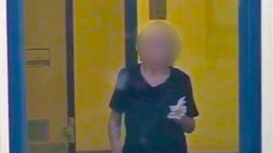 An image of the woman in her room at the high-security detention centre, before guards blacked out the window.