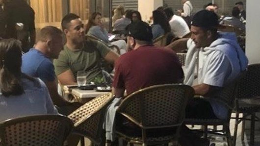 Support: Jarryd Hayne having dinner with former Parramatta teammates Corey Norman and Nathan Brown on Wednesday night.