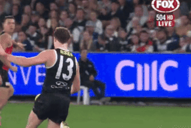 Geelong’s Patrick Dangerfield makes late contact on St Kilda’s Ryan Byrnes.