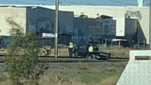 A ute became stuck on tracks between Laverton and Werribee while trying to bypass traffic gridlock on the  freeway.