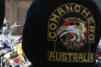 Police have arrested two alleged associates of the Comanchero bikie gang. 